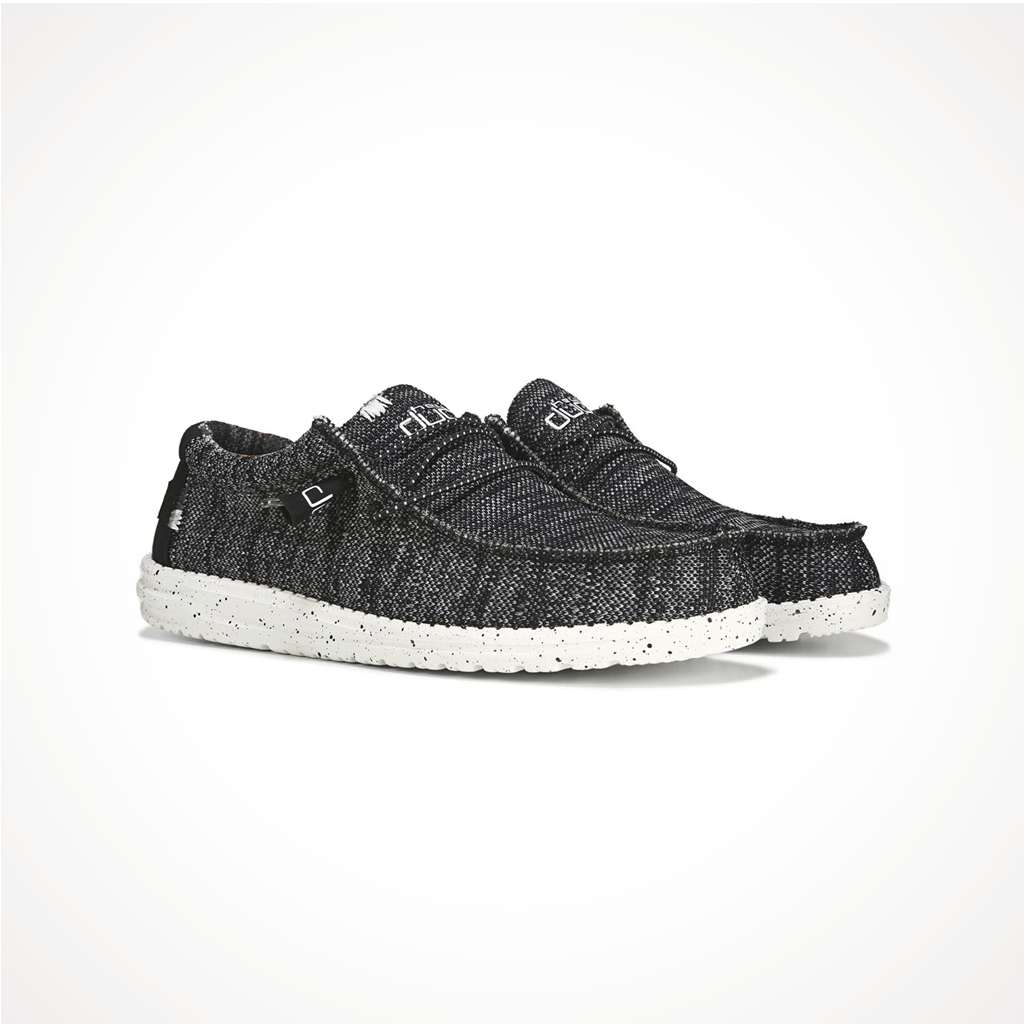 Product image: Footwear Hey Dude Mens Wally Sox Black White Woodland Camo, shown from a three-quarter angled view.