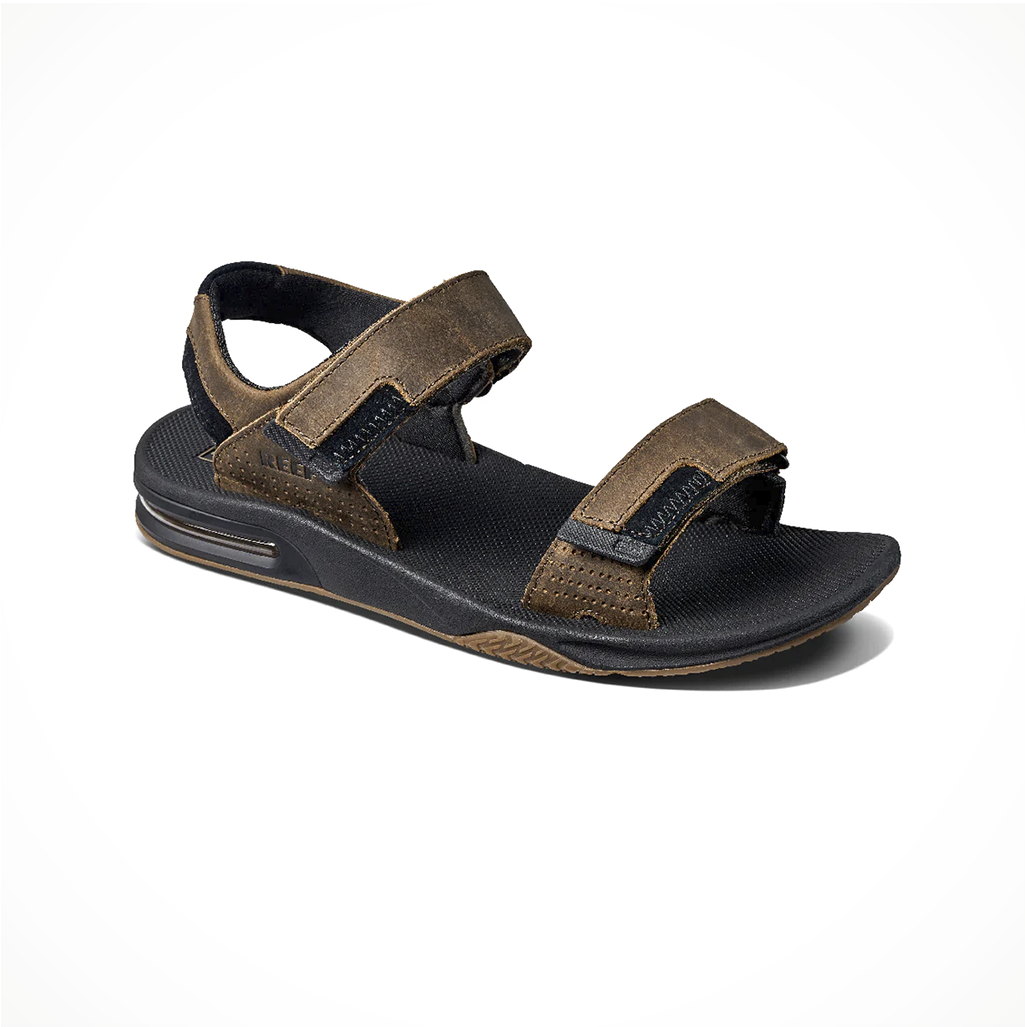 Product image: Footwear Reef Mens Fanning Baja LE Black Brown, shown from a three-quarter angled view.