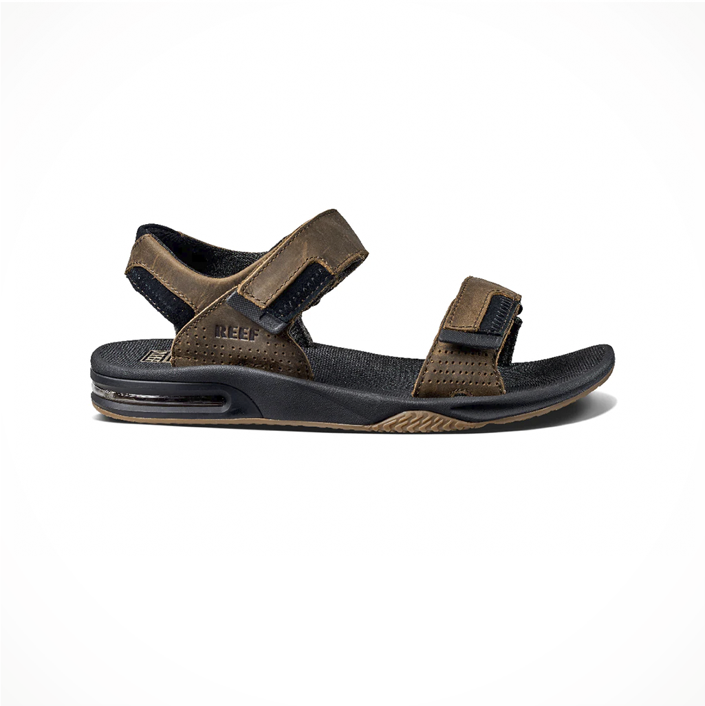Product image: Footwear Reef Mens Fanning Baja LE Black Brown, side profile view.