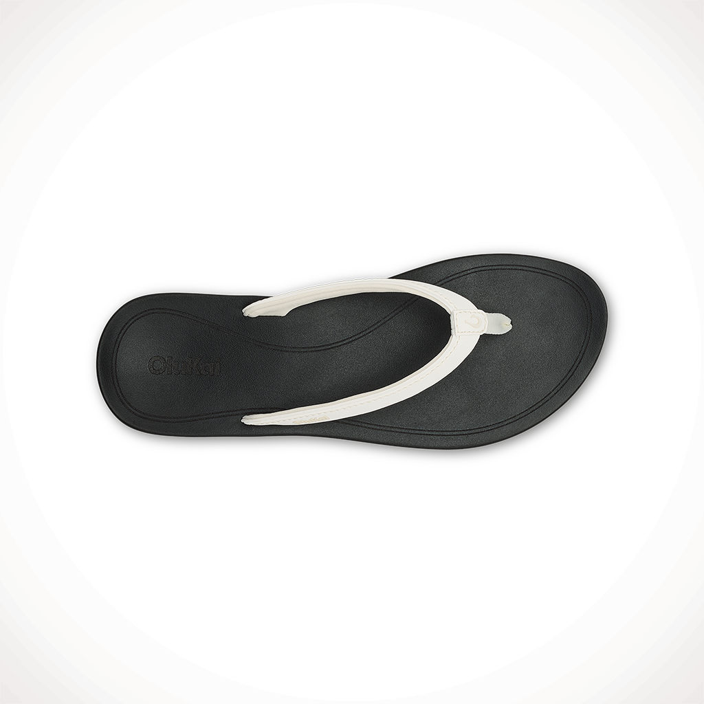 Product image: Olukai Uiki Bright White Lava Rock Womens 2025, shown from above.