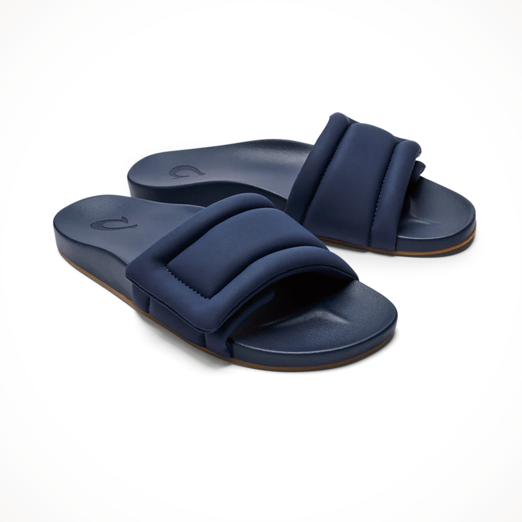 Product image: Olukai Womens Sunbeam Slide Navy, shown from a three-quarter angled view.