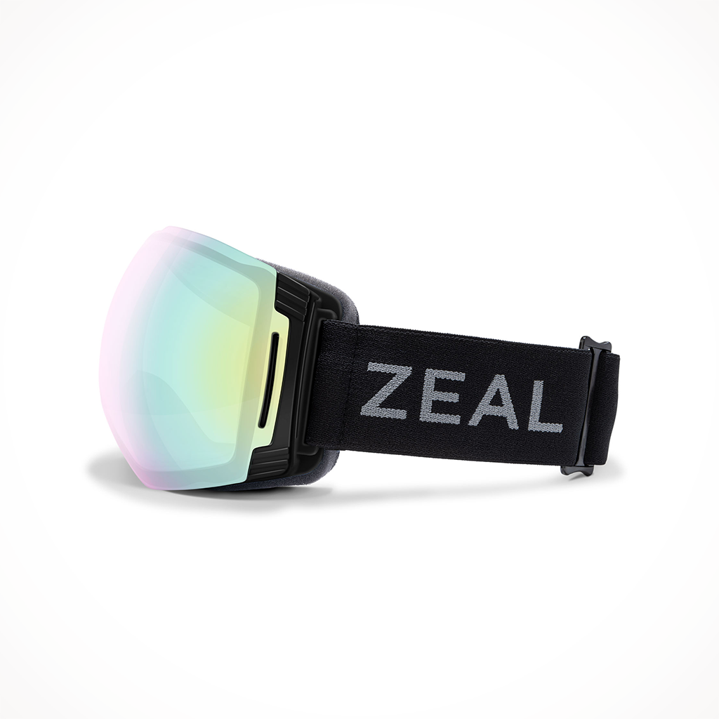 Product image: Zeal Cloudfall XL Dark Night A Lchemy Mirror Sky Blue Mirror Goggle 2025, shown from the left side profile.