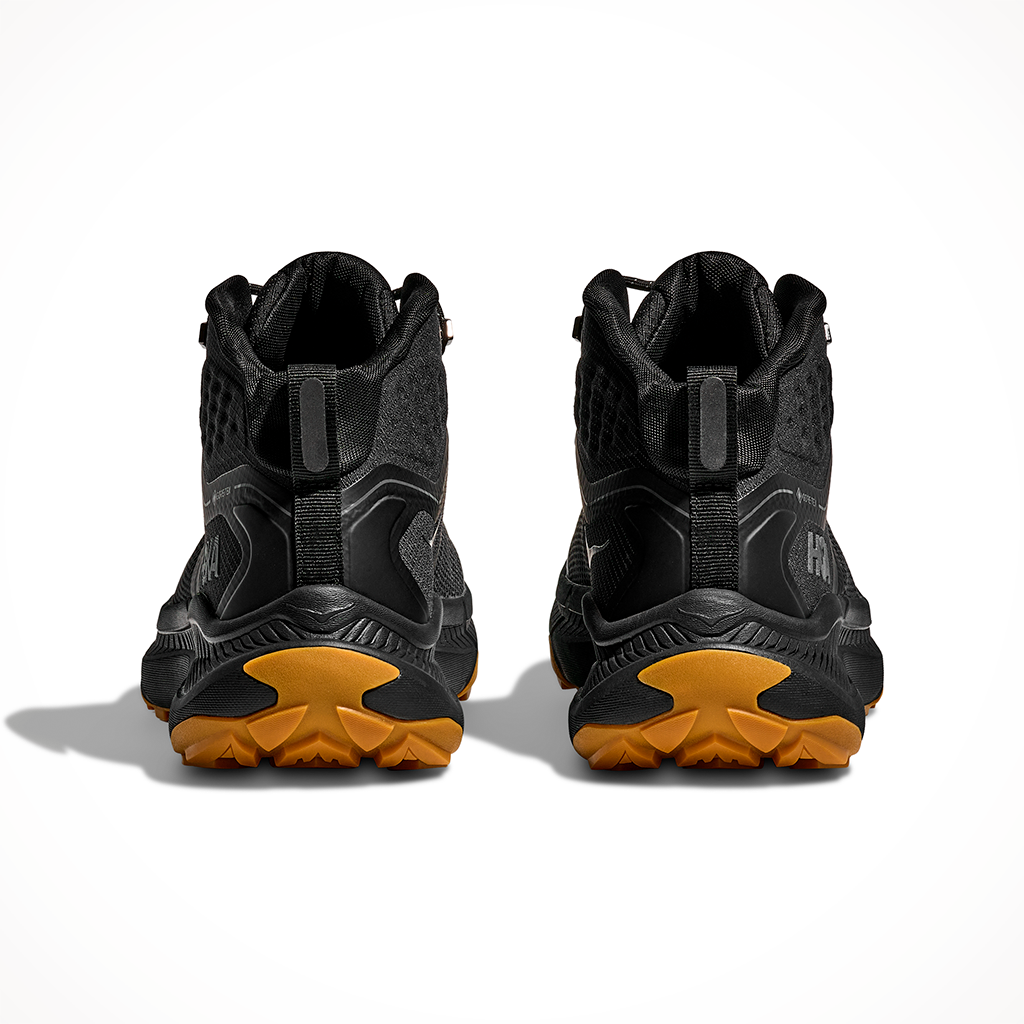 Product image: Hoka Transport Hike GTX Black Black Mens 2025, shown from the back.