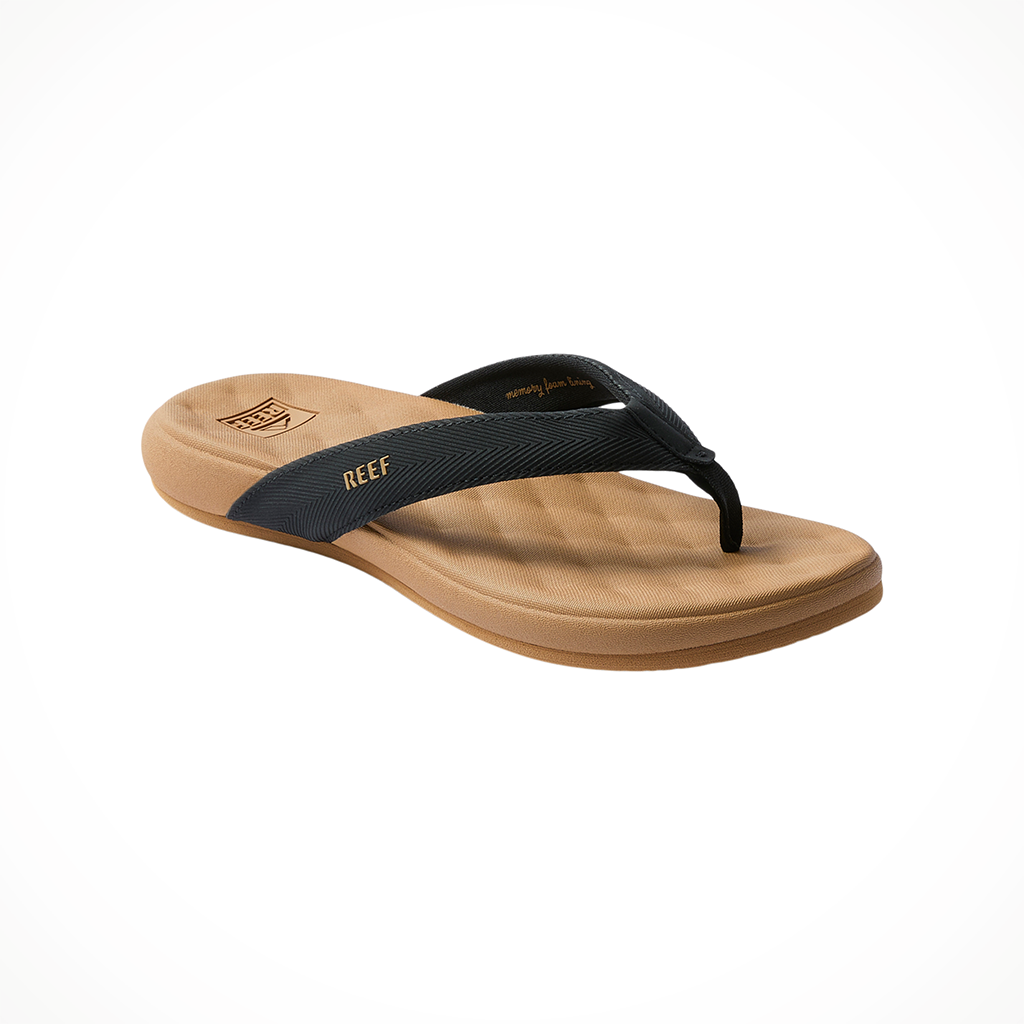 Product image: Reef Cushion Melody Black Tan Womens 2026, shown from a three-quarter angled view.