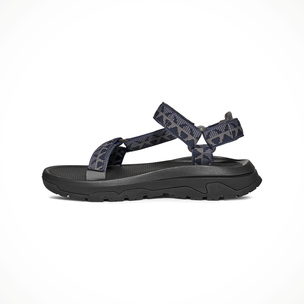 Product image: Teva Hurricane XLT 3 Criss Cross Navy Grey Mens 2026, shown from the left side profile.